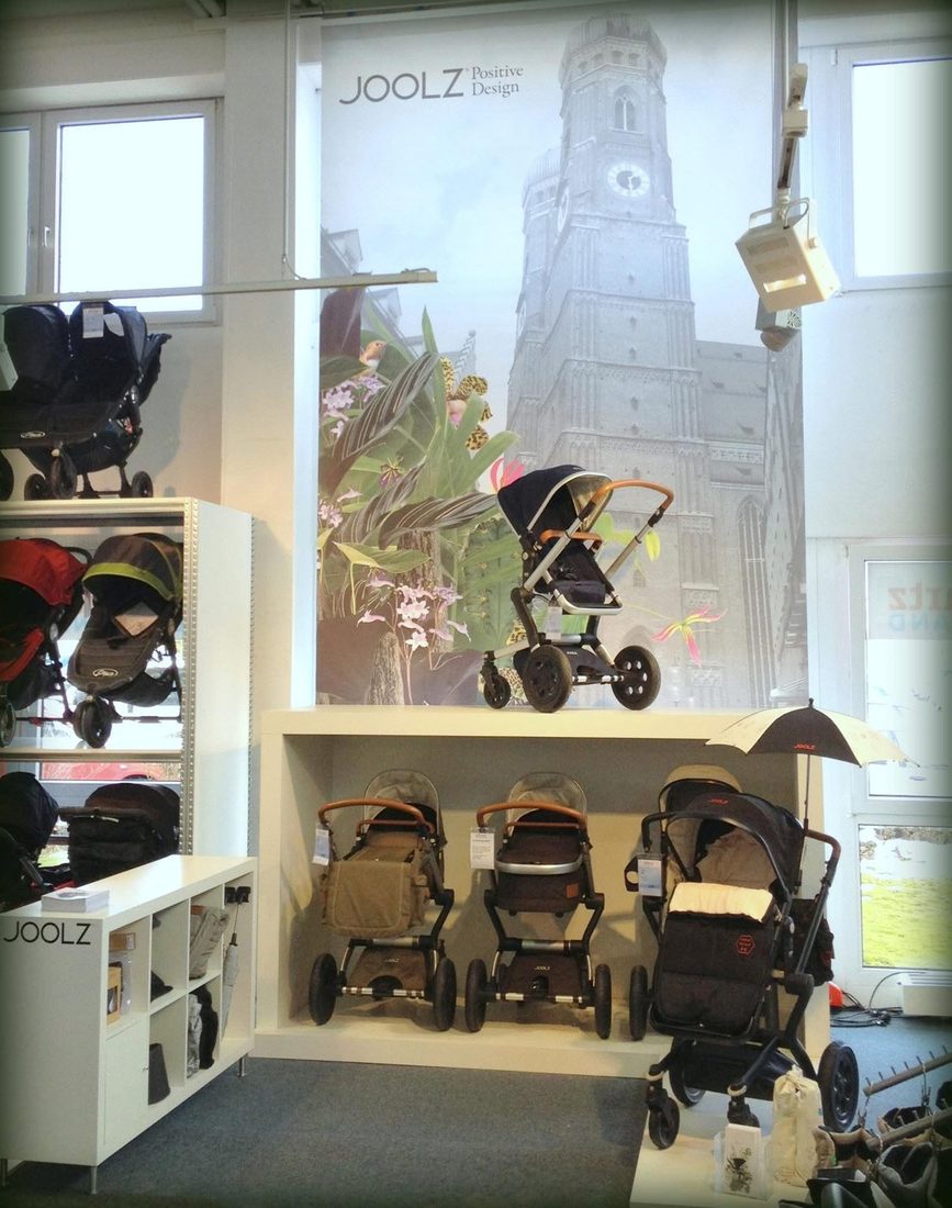 Joolz shop-in-shop with strollers in front of a mural of Munich’s Frauenkirche at Reinartz in Munich