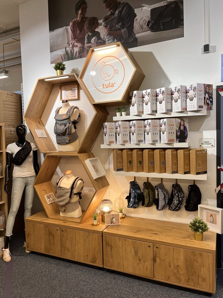 Shop-in-shop area for baby carriers in specialty retail